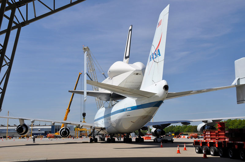 Space shuttle Enterprise hoisted off jumbo jet in New York