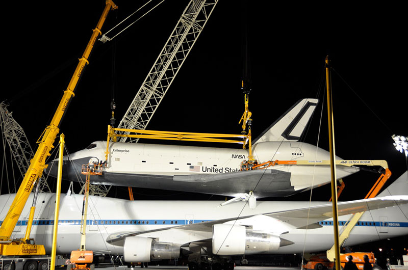 Space shuttle Enterprise hoisted off jumbo jet in New York