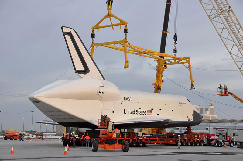 Space shuttle Enterprise hoisted off jumbo jet in New York